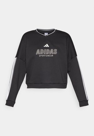 Fekete Adidas sportpulóver fehér márkajelzéssel és oldalsó csíkkal, laza szabással és V-nyakú dizájnnal.