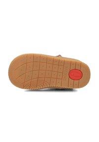 Lichtbruin rubberen zool met textuur voor grip, voorzien van een rode cirkelaccent en een ingedrukt merknaam. Kenmerkend patroon inclusief een raster en sterren.