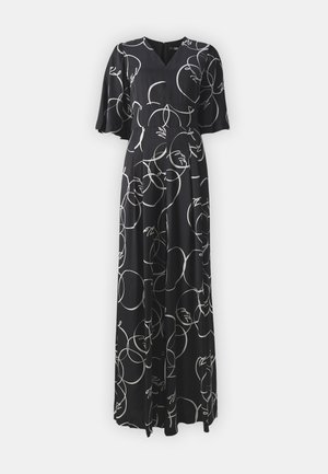 Čierne šaty s hlbokým výstrihom do V, s padavými rukávmi a zavinovacím dizajnom, pokryté bielymi kruhovými vzormi a tvárami, vyrobené z hladkej látky.
