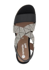 Black leather and woven pattern sandals with a cross strap design, featuring a brown cushioned insole and "remonte soft" branding.
