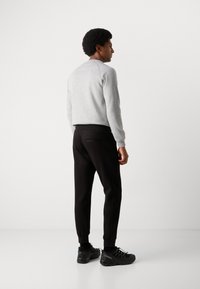 Antony Morato TROUSERS REGULAR FIT LOGOED METAL BADGE RUBBER PATCH - Tepláky - black