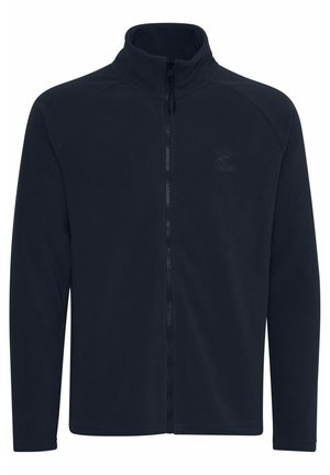 Navy fleece jacket with a high collar, full zip front, and long sleeves. Features a subtle logo on the chest and smooth texture.