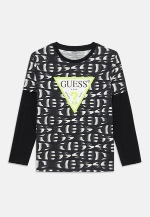 Schwarzes Langarmshirt mit grafischem Muster und einem neongrünen Dreieckslogo in der Mitte, auf dem der Text "GUESS" steht, aus weichem Stoff.