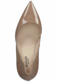 Beige patent leather pump with a pointed toe, smooth upper, and minimalistic design. Interior features branding.