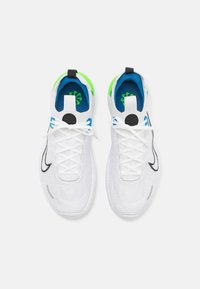 White knit athletic shoes with black accents and gray sole. Features blue and green inner lining, black circular logo, and standard lacing.