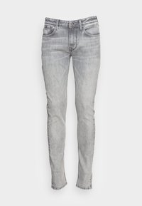 Ljust grå denim skinny jeans med fem fickor, dragkedja och hällor för bälte. Tyget har ett subtilt blekningsmönster och platta sömmar.