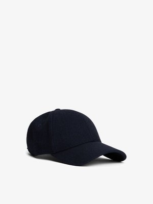 Marineblå cap laget av teksturert herringbone-stoff. Har en buet skjerm og en tettsittende bakdesign.