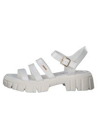 Valkoiset nauhalliset sandaalit paksulla pohjalla, joissa on solkikiinnitys, sileä pinta ja kolme leveää nauhaa jalan päällä.