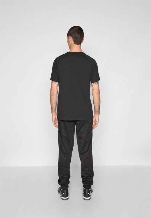 PUMA Tracksuit bottoms - black/matte gold-coloured/white — foto 3