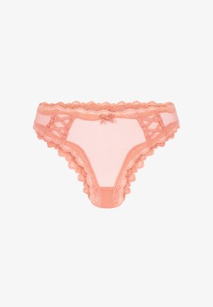 Perzikkleurige kanten string met golvende randen, doorschijnende stof en een klein strikje aan de voorkant. Kenmerkt zich door een kruislingse ontwerp aan de zijkanten en heeft een zachte textuur.