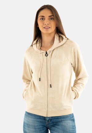 Felpa con zip beige dal texture morbido, con cappuccio regolabile e tasche laterali. Presenta un logo discreto sul petto e polsini a costine.