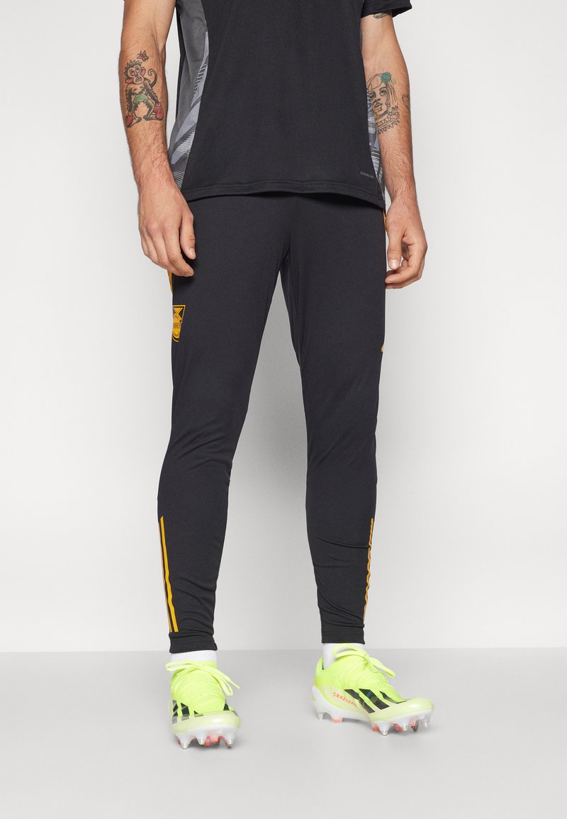 adidas Performance JAMAICA JFF TRAINING PANT - Leggings - black/semi solar gold