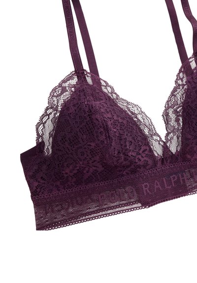 Syväluumuinen pitsirintaliivit, joissa on kolmionmuotoiset kupit, läpinäkyvä kukkakuosi ja brändätty joustava nauha. Säädettävät olkaimet lisäävät monipuolisuutta.