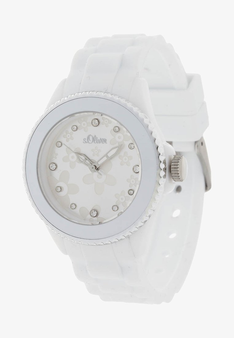 Biały silikonowy zegarek z kwiatowym wzorem na tarczy, srebrnymi akcentami, kryształowymi znacznikami oraz teksturowanym pierścieniem. Posiada solidny pasek i zapięcie.