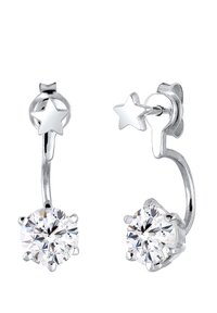 Boucles d'oreilles en argent en forme de créole avec un design en étoile. Présentent des cristaux ronds et transparents sertis en griffes, offrant un accent étincelant.