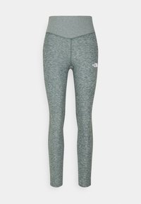 Leggings i en texturerad, dämpad grön färg med en bred, ribbad midja. Har en liten vit logotyp på höger sida.