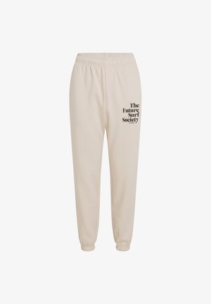 Beige katoenen sweatpants met een elastische tailleband, taps toelopende boorden en zwarte tekst die "The Future Surf Society" op het linkerbeen leest.