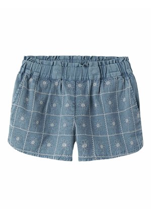 Short bleu avec taille élastique et motifs brodés de marguerites blanches disposés en grille, avec poches latérales.