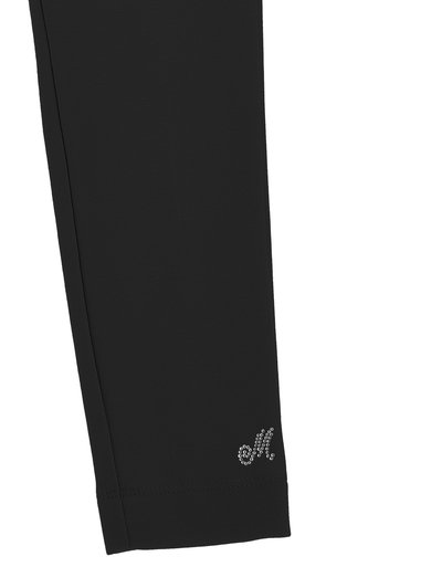 Leggings deportivos negros con una tela texturizada. Presenta un pequeño logo de strass cerca del puño. Diseño ajustado, hasta el tobillo.