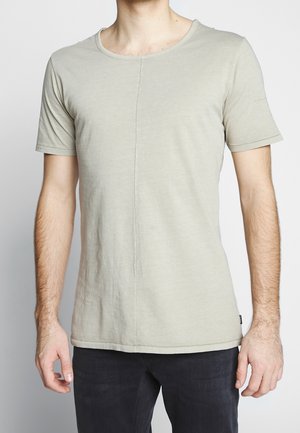 Light gray short-sleeve T-shirt with a round neckline. Crafted from soft fabric, featuring a central seam and a straight cut.