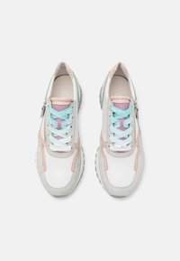 White and gray sneakers with pink and light blue accents, mesh and suede materials, perforated texture, and zip closure design.