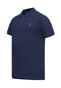 Navy blue polo shirt made of cotton with a classic collar, two-button placket, and a blue logo embroidery on the left chest.