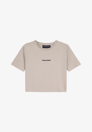T-shirt cropped beige in cotone con scollo rotondo e maniche corte. Caratterizzato dal logo "PEGADOR" stampato in nero sulla parte anteriore.