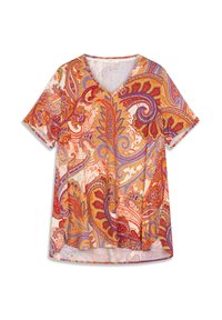 Blouse à manches courtes et col en V, présentant un motif cachemire vibrant en rouge, orange et violet sur un fond crème, avec un ourlet arrondi.