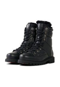 Schwarze Leder-Wanderschuhe mit strukturierter Oberfläche, Metallösen, gepolstertem Kragen und dicker Gummisohle, die auf Langlebigkeit und Grip ausgelegt ist.