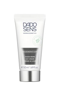 White tube with silver base; features "DADO SENS DERMAcosmetics" and "REGENERATION" text. Capacity: 50 ml. Green leaf icon indicating natural ingredients.