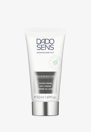 White tube with silver base; features "DADO SENS DERMAcosmetics" and "REGENERATION" text. Capacity: 50 ml. Green leaf icon indicating natural ingredients.
