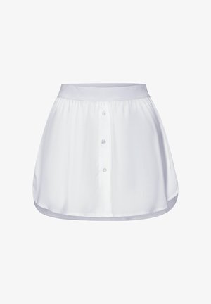 White skirt made of smooth fabric, featuring a front button placket, elastic waistband, and curved hemline with an overall loose fit.
