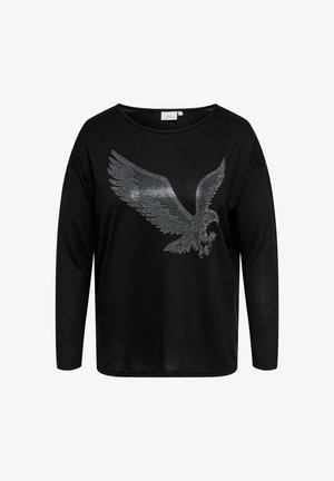 Camiseta negra de manga larga con un gran diseño de águila de strass en la parte delantera. La tela parece suave con un corte holgado y un escote ancho.