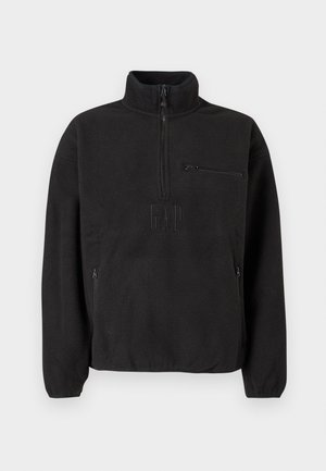 Čierny pulóver z flísu s vysokým golierom, polovičným zipsom a predným vreckom na zips. Má textúrovanú tkaninu a vyrazené logo.