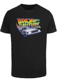 Black T-shirt featuring a graphic print of a silver DeLorean car, vibrant text reading "Back to the Future" and "Outatime Tour 85."