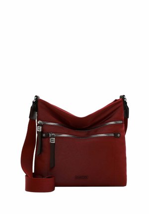 Red fabric crossbody bag with two front zippered pockets, adjustable strap, and leather accents. Smooth texture and casual design.