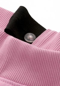 Pink ribbed fabric with black textured collar and transparent button detail. The fabric has a soft, slightly stretchy appearance.