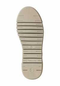 Semelle de chaussure en caoutchouc beige clair avec des rainures et des crêtes texturées, taille 37, logo de la marque "Tamaris" embossé près du talon.