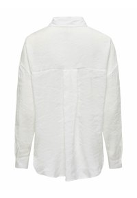 Chemise blanche à manches longues avec col, en tissu texturé, épaules tombantes et détail plissé au dos.