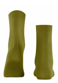 Grüne Socken mit geripptem Muster und vertikalen Linien, im Crew-Längen-Design mit verstärktem Fersen- und Zehenbereich.