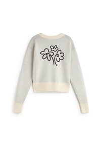 Gray cropped sweater with cream ribbed cuffs and hem. Features a black floral design on the back. Soft texture and relaxed fit.