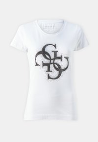 Camiseta blanca de algodón con un diseño gráfico circular negro que incluye puntos y letras estilizadas en la parte frontal. Manga corta, escote redondo.
