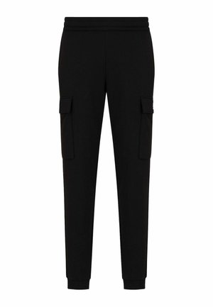 Pantalones cargo negros con cintura elástica, dos bolsillos laterales y tobillos ajustados. Hechos de una tela suave con una textura lisa.