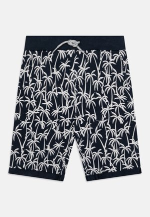 Navy swim shorts with white palm tree print, drawstring waist, and soft texture. Length reaches mid-thigh with a straight cut.
