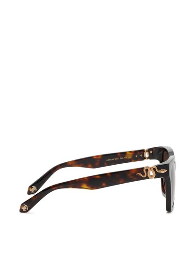 Lunettes de soleil écaille noires et marron avec des branches épaisses et une décoration serpent dorée sur la branche.