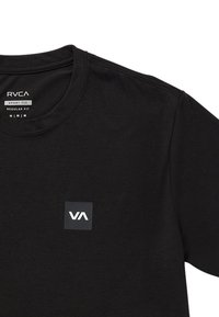 Black cotton sport t-shirt featuring a crew neck, regular fit, and a small rectangular logo on the left chest in white and gray.