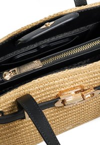 Woven straw handbag with a black leather strap, gold hardware, and a zippered compartment. Interior includes pockets for organization.