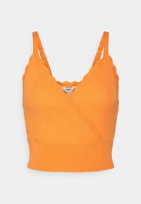 Oranžový pletený crop top s výstřihem do V, vlnitými okraji a nastavitelnými ramínky. Hladká textura s přiléhavým střihem.