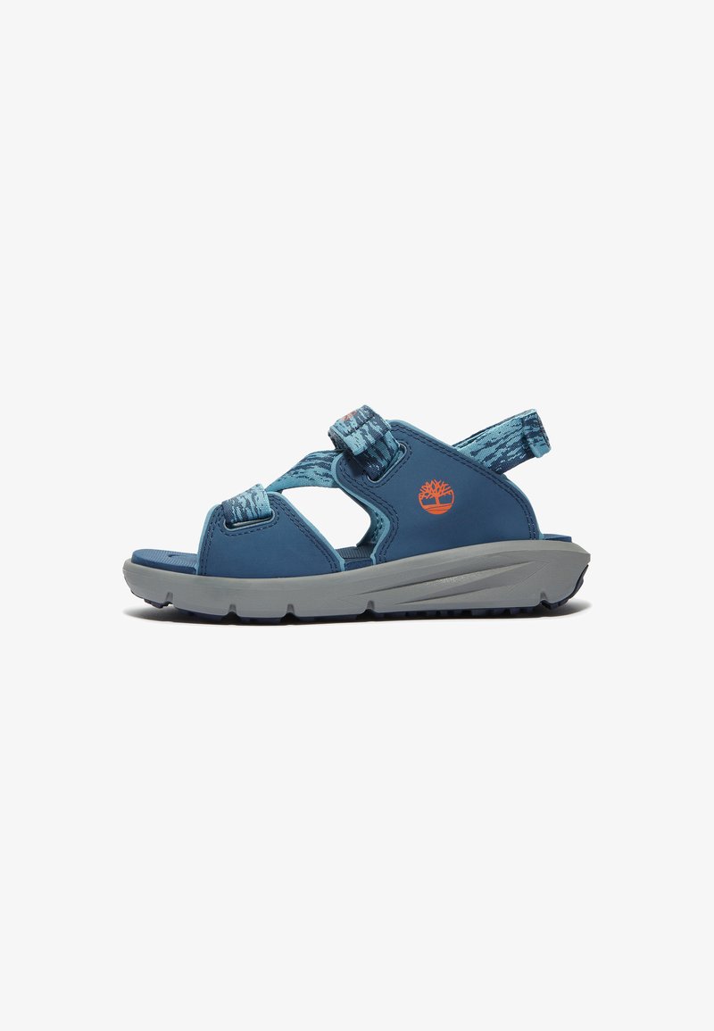 Blue sandal with adjustable straps, gray sole, textured pattern on straps, and logo accent. Lightweight design for comfort and support.