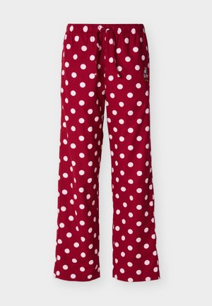 Sarkanas pidžamas bikses ar baltām polka punktu apdrukām un elastīgu jostiņu, labajā pusē mazs izšūts Minnijas Peles attēls.